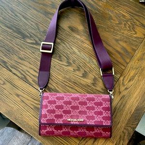 Michael Kors burgundy cross body. Adjustable strap. Excellent condition